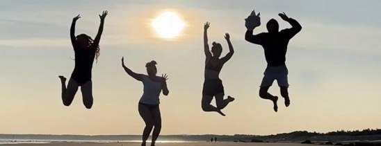 People jumping on beach image